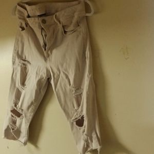 Beige ripped Capri pants